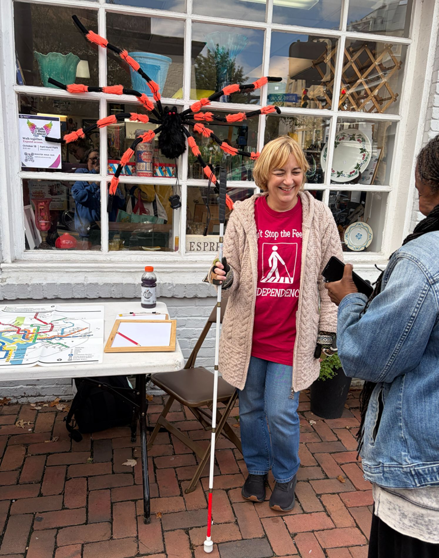 woman standing w/white cane